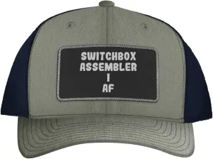 Switchbox Assembler I AF - Leather Black Patch Engraved Trucker Hat